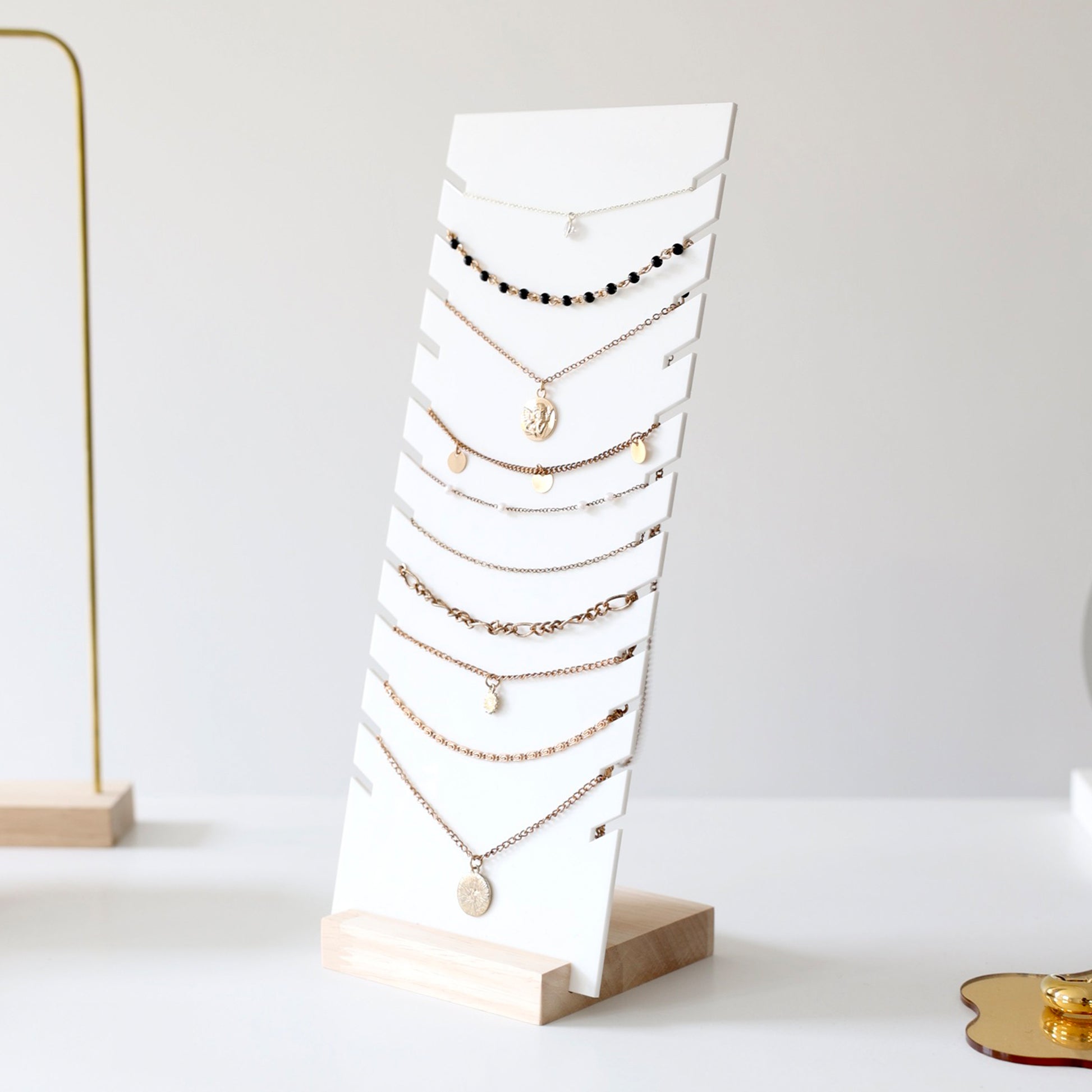 White and wood multiple necklace displays