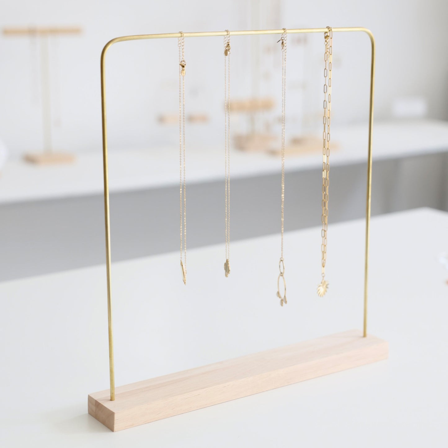 Light wood and brass jewelry holder