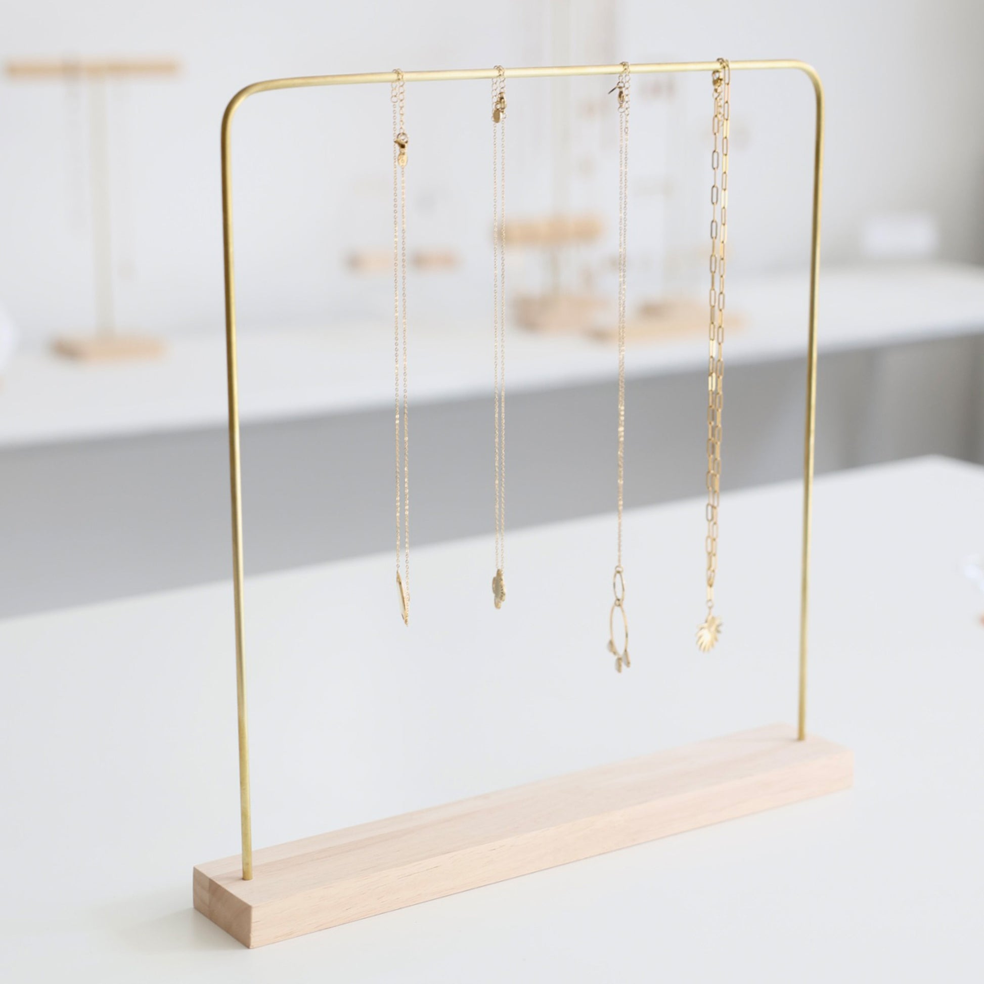 Light wood and brass jewelry holder