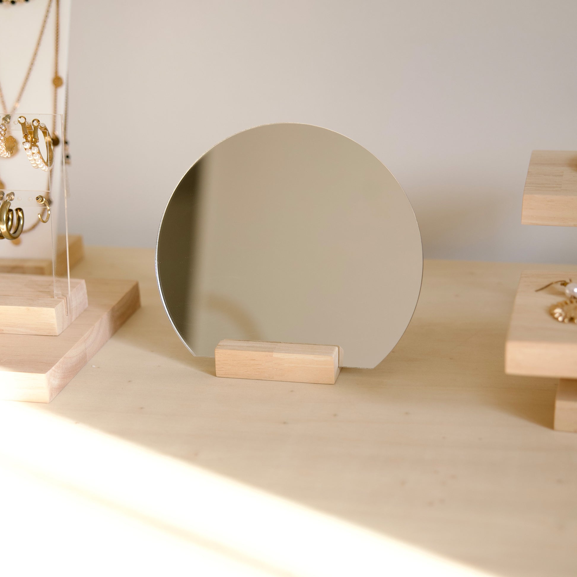 Round mirror with wooden base by Makk Design