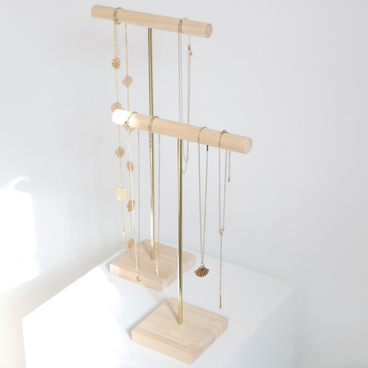 wood and gold metal necklace holders for professionals and jewelry brands 