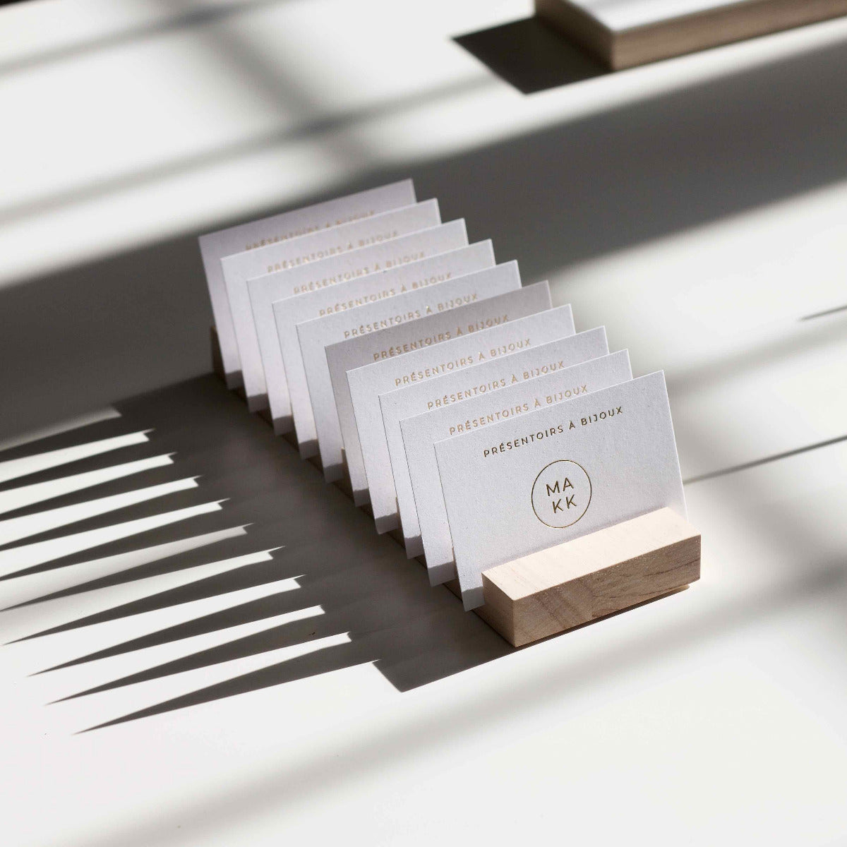 Professional wooden business card holder by Makk Design.