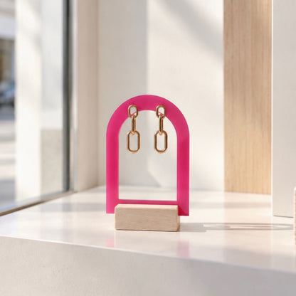 support pour bijoux rose en forme d'arche